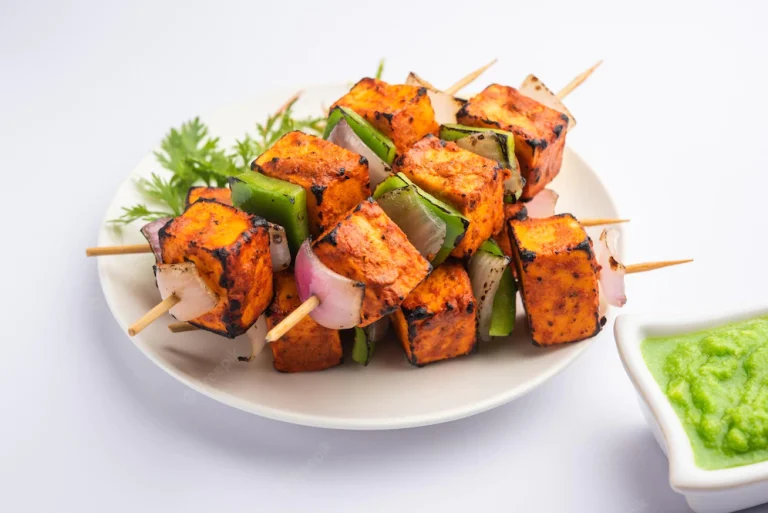 paneer-tikka-is-indian-dish-made-from-chunks-cottage-cheese-marinated-spices-grilled-tandoor_466689-76784